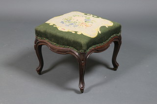 A Victorian mahogany serpentine stool