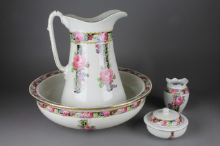 An Edwardian 4 piece wash stand set decorated with roses