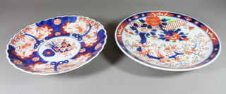 A 19th Century scallop Imari dish decorated with panels of flowers 12", a similar charger decorated a garden scene 13 1/2"