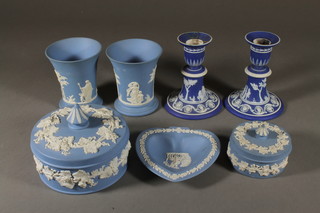 A pair of Wedgwood blue Jasperware waisted vases 4", 2 ditto jars and covers 4 1/2" and 3", ditto pair of candlesticks 5" and a heart shaped ashtray