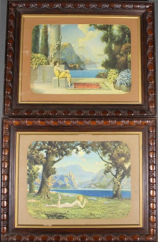 A pair of 1930's coloured prints, studies of ladies in mountainous landscapes, contained in fancy carved wood frames 40" x 19"