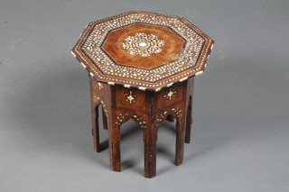 A 19th Century Turkish hardwood octagonal tea table, ebony and  bone inlaid, the folding stand pierced with mihrab 14.5"h x  14.5"w