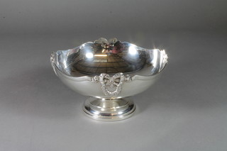 A waisted silver fruit bowl with ribbon and laurel decoration, raised on a spreading foot, Sheffield 1918, by Mappin & Webb, 13 ozs  ILLUSTRATED