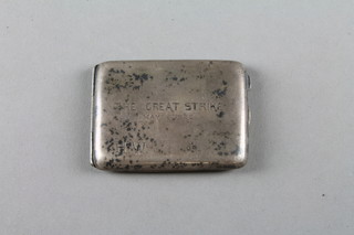 A silver match sleeve engraved The Great Strike
