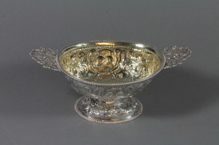 A Dutch silver oval repousse pedestal bowl with pierced handles, 9.5", 8 ozs
