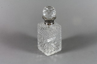 A cut crystal spirit decanter with silver collar, London 1984