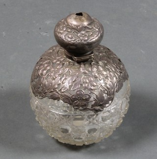 A globular cut glass dressing table jar with pierced silver lid 5"