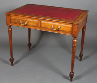 A Victorian mahogany writing table inset a red leather skiver, fitted 2 short drawers with brass swan neck drop handles 30"h x  36"w x 23.5"d