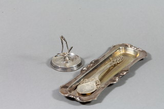 A rectangular silver tea, a fancy spoon and ring tree