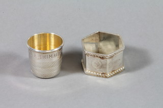 A novelty silver tott "Just a Thimble Full" together with a silver napkin ring
