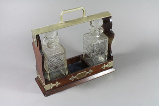 An Edwardian oak and silver plated mounted tantalus together with 2 decanters 