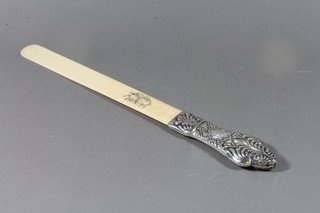 A repousse silver and ivory paper knife