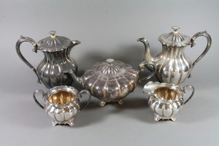 A 5 piece silver plated tea set of melon form comprising teapot, coffee pot, hotwater jug, twin handled sugar bowl and cream jug by Mappin & Webb