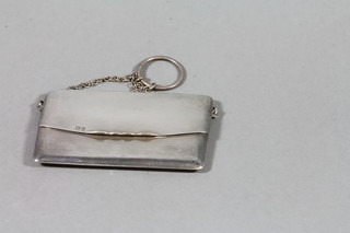 A silver card case with hinged lid, London 1914 2 ozs 