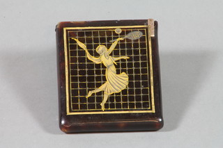 A tortoiseshell card case decorated a figure of a lady playing tennis, having a hinged lid 3"