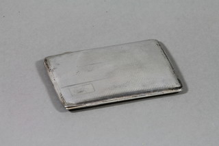 A silver cigarette case with engine turned decoration, Birmingham 1914, 4 ozs 