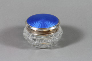 A circular cut glass dressing table jar with blue enamelled and silver lid, London 1955, 4" (slight chip to enamel)
