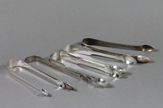A pair of George III silver sugar tongs, London 1802, 2 pairs of Georgian sugar tongs and 2 Victorian pairs of sugar tongs, 6 ozs
