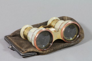 A pair of gilt metal mother of pearl mounted opera glasses