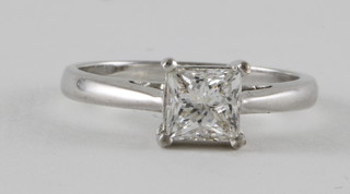 An 18ct white gold dress ring set a square princess cut diamond, approx 1.08ct, with certificate