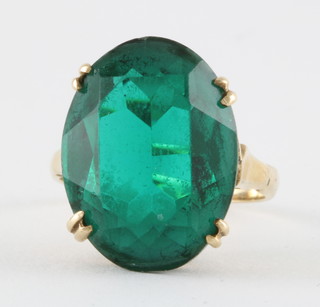 A 9ct gold dress ring set a green oval cut stone