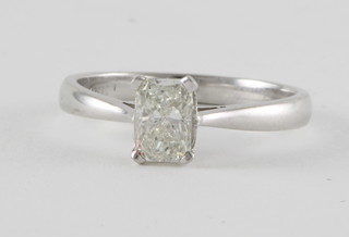 An 18ct white gold dress ring set a rectangular princess cut diamond, approx 0.90ct