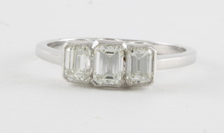 An 18ct white gold dress/engagement ring set 3 baguette cut diamonds approx. 1.25ct