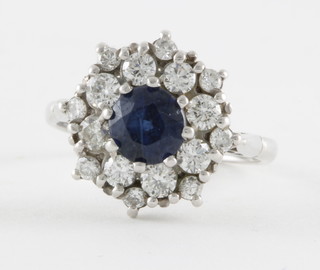 An 18ct white gold cluster dress ring set sapphires and diamonds