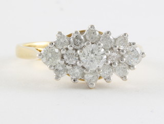An 18ct yellow gold cluster dress ring set numerous diamonds