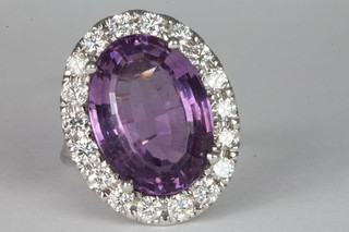 An 18ct gold dress ring set a large amethyst approx. 10ct surrounded by diamonds approx 2ct ILLUSTRATED