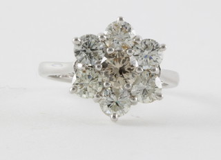 An 18ct white gold champagne diamond and white diamond cluster ring set 7 diamonds, approx. 2.46ct