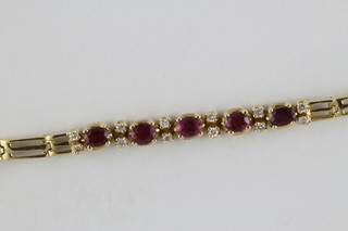 An 18ct yellow gold bracelet set rubies and diamonds approx 0.25ct, total weight 12.4 grams