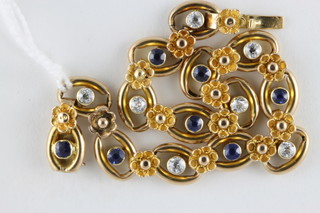 A 15ct gold bracelet set sapphires and diamonds, total weight 12.7 grams