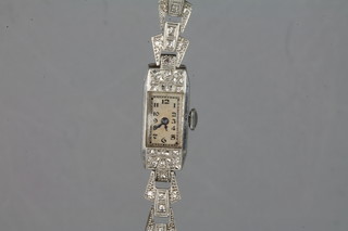 A lady's Art Deco platinum cocktail wristwatch set diamonds with a 9ct white gold bracelet ILLUSTRATED
