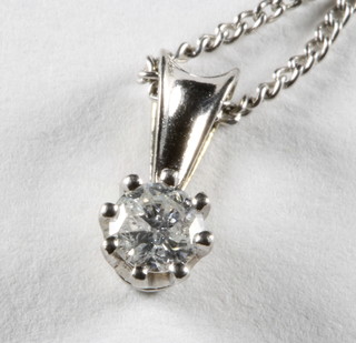 A 9ct gold pendant set a diamond, hung on a fine gold chain, approx 0.30ct