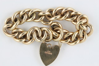 A 9ct gold curb link bracelet with heart shaped padlock clasp, 54.2 grams
