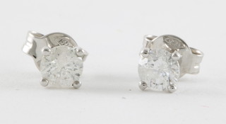 A pair of 18ct stud earrings, set diamonds, approx. 0.71ct