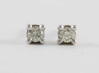 A pair of 18ct white gold stud earrings earrings, approx 0.20ct
