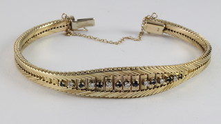 A 9ct gold bracelet set sapphires and diamonds 