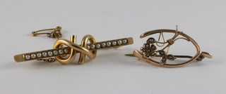 A 15ct gold bar brooch set demi-pearls together with a 9ct bar brooch in the form of a wishbone set demi-pearls