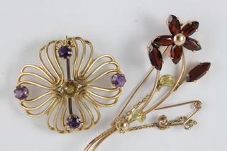 A 9ct yellow gold brooch set amethysts and citrene together with a gold floral spray bar brooch set garnets