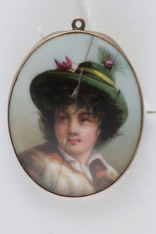 A 19th Century oval porcelain plaque decorated a head and shoulders portrait of a boy mounted as a brooch, f, 