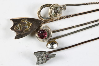 A stick pin in the form of a foxes mask and 5 other stick pins