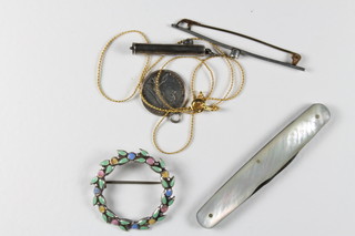 A miniature silver cased propelling pencil 1" with mother of pearl grip and a small collection of costume jewellery