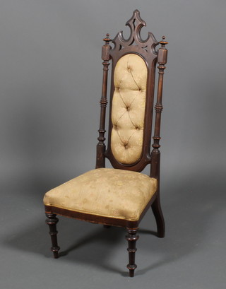 A Victorian mahogany Gothic high backed chair on turned legs