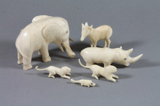 A carved ivory figure of an elephant 3" and other carved ivory figures