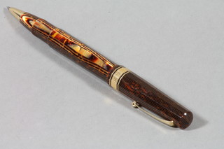 An Omas Extra ball point pen in a tortoiseshell and gilt mounted case 