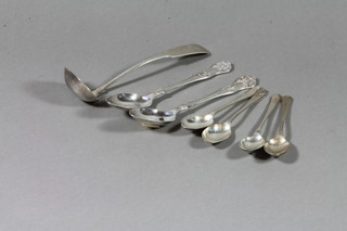 A 19th Century provincial silver fiddle pattern sauce ladle marked E & M ABDN, 2 Victorian silver Queens pattern teaspoons, 4 silver spoons decorated golfing trophies, 5 ozs