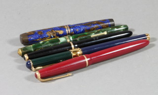 A red Parker Duofold fountain pen, a black Parker fountain pen, a Conway Stuart No.12 fountain in a green marble finished case, a The Three Point's T fountain pen in blue marble case by R & J Arnold of London and a German fountain pen