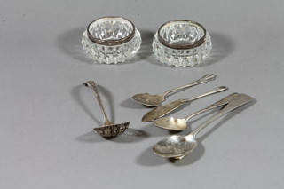 A silver jam spoon, a silver sifter spoon, silver butter knife 3 ozs and 2 cut glass jars with silver rims and a thimble